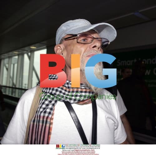 Gary Glitter arrives in UK after jail