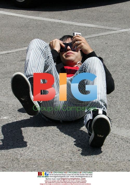 Singer Pete Wentz pretends to fall while shopping