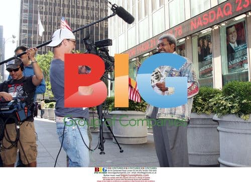 Don King waves flags and holds Nadal cutout