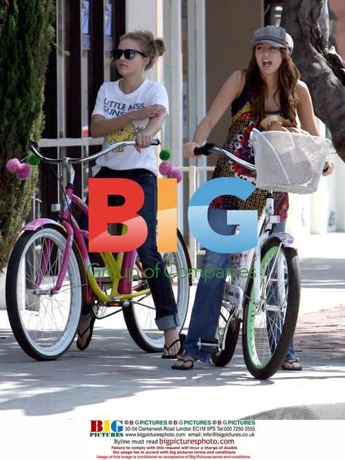 Miley Cyrus and Emily Osment bike to breakfast