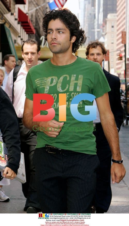 Adrian Grenier walks with mystery woman