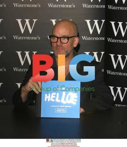 R.E.M. Frontman Michael Stipe and Photographer Sign Book