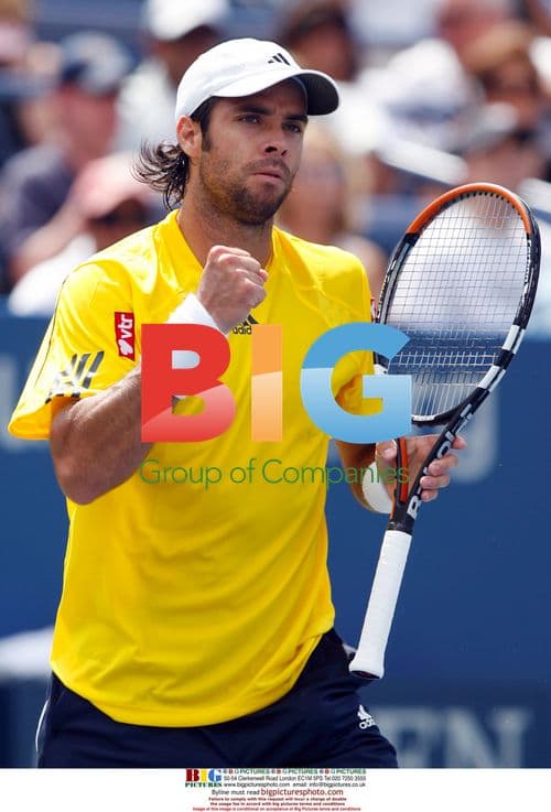 Fernando Gonzalez serves at the U.S. Open