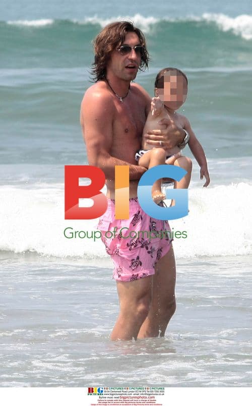 Andrea Pirlo with family on beach in Italy