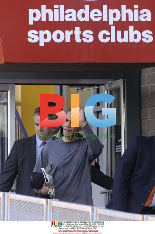 Obama waves to supporters after workout