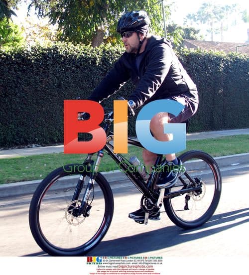 Russell Crowe bicycles in Beverly Hills