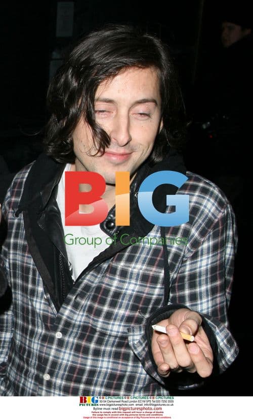 Carl Barat with friends outside Whisky Mist, London
