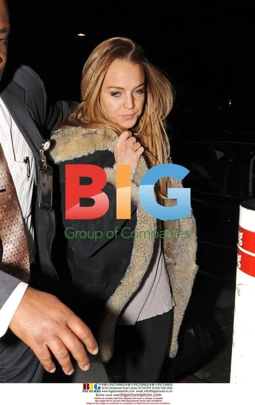 Lindsay Lohan Appears Camera Shy at LAX