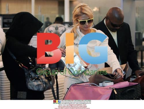 Paris Hilton and Brittany Flickinger depart LAX