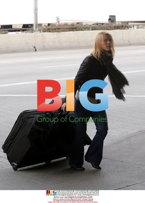 Claire Danes Navigating Airport with Luggage