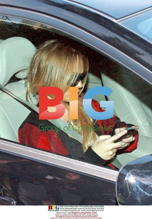 Lindsay Lohan waits outside assistant's home