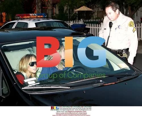 Lindsay Lohan Waits Outside Assistant's Home