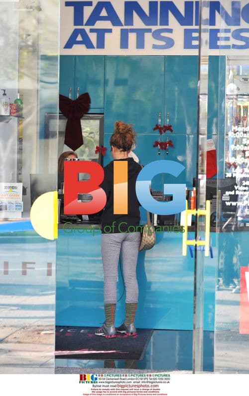 Shenae Grimes Leaves Gym and Gets Tan