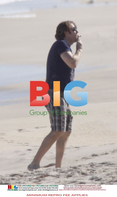 Jonathan Ross Relaxes on Beach