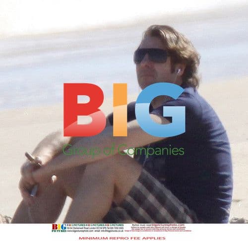 Jonathan Ross Relaxes on the Beach