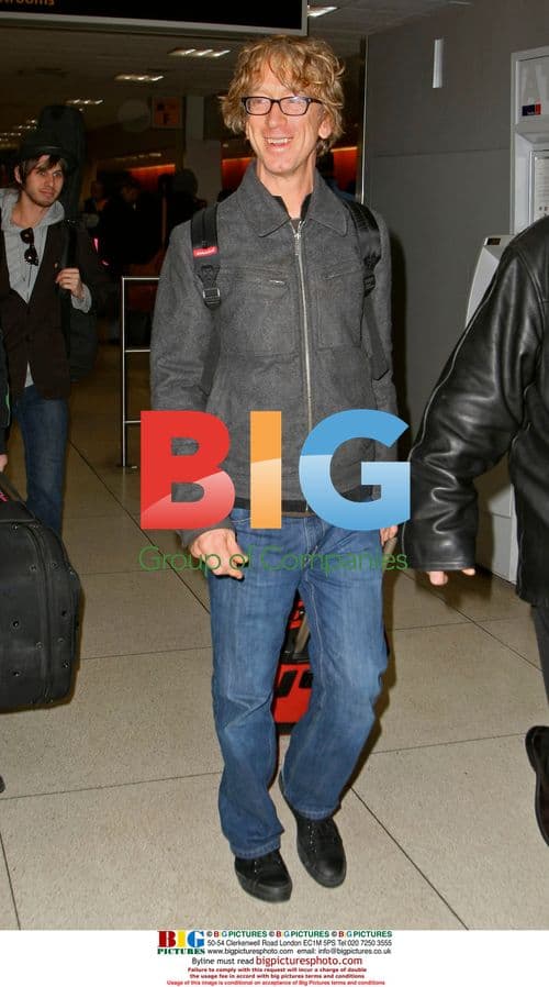 Andy Dick arrives at JFK airport with band