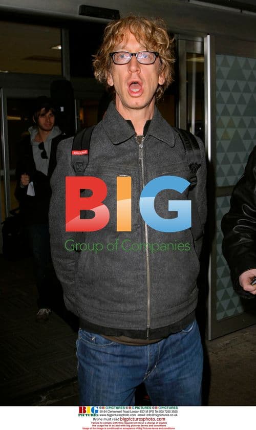 Andy Dick arrives at JFK with band