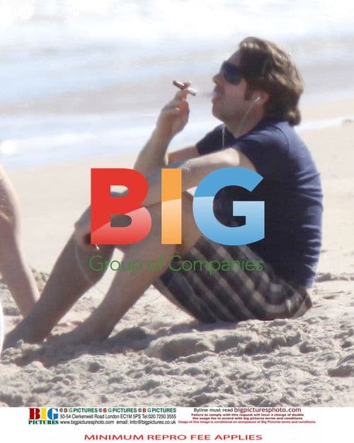 Jonathan Ross Relaxes on Beach