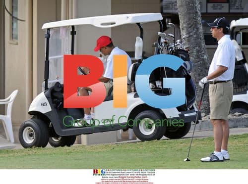 Barack Obama eats sandwich after golfing