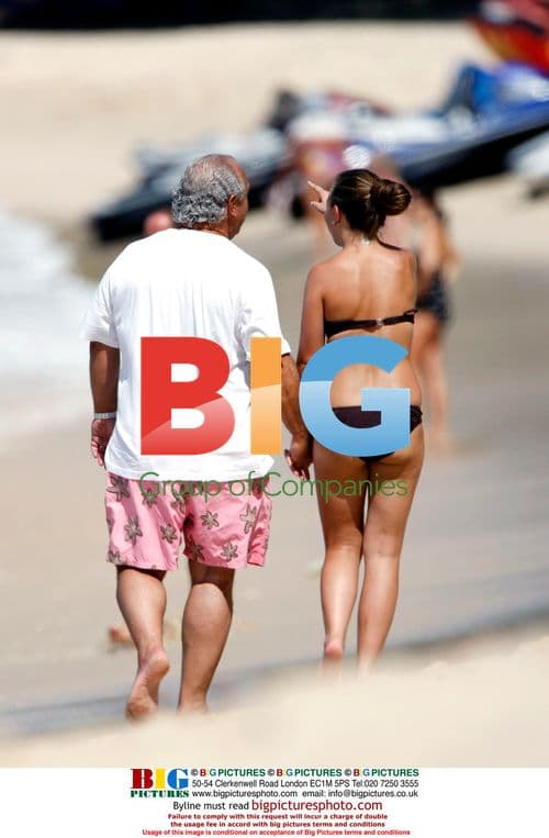 Philip Green and Daughter on Caribbean Beach