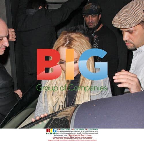 Lindsay Lohan Slinks Out of Villa Lounge