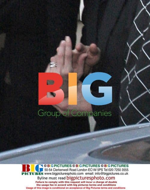 Tom Cruise and Katie Holmes Leave Cafe with Security