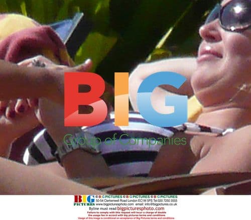 Alex Curran sunbathing in Dubai