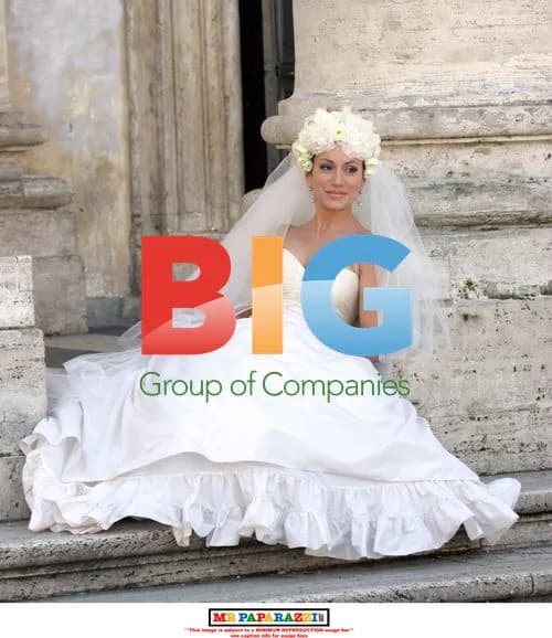 Nancy Dell'Olio posing in wedding dresses in Rome