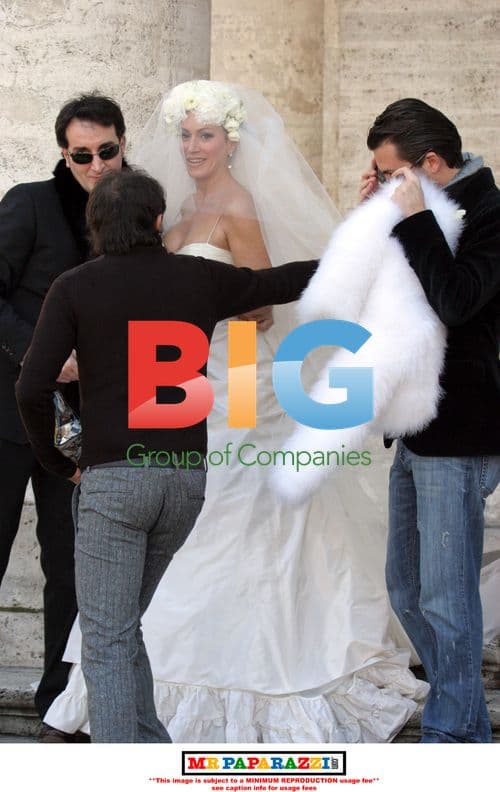 Nancy Dell'Olio poses in wedding dress