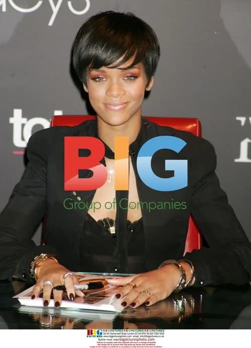Rihanna Promotes Totes Umbrellas at Macy's