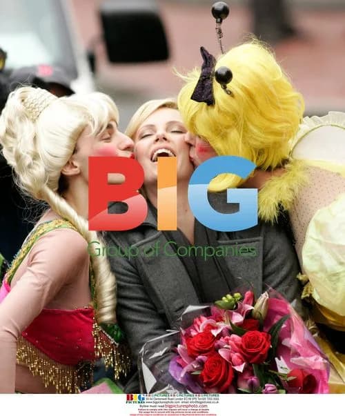 Charlize Theron Receives Kisses at Hasty Pudding Parade