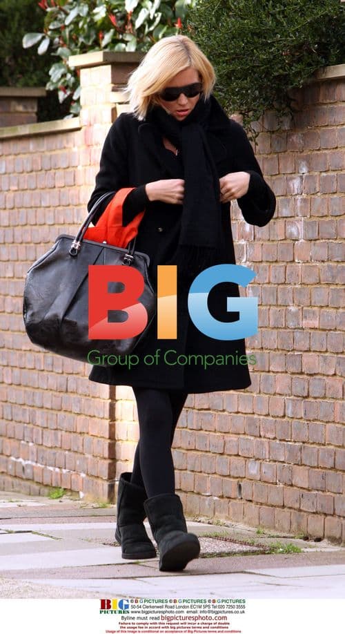 Denise van Outen returns home from shopping