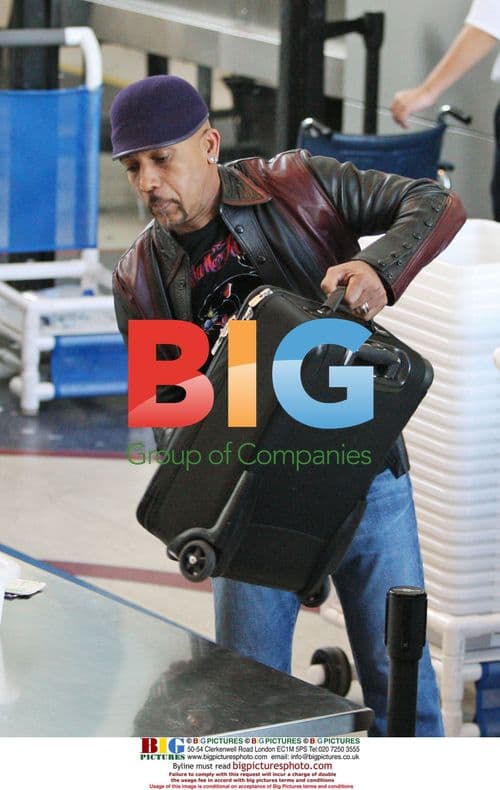 Montel Williams Departs LAX with Wife Tara