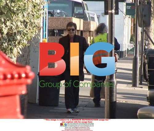 Paul McCartney Grabs Photographer's Camera