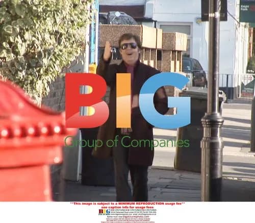 Paul McCartney Grabs Camera at Gym