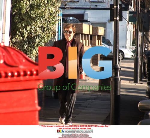 Paul McCartney Grabs Camera at Gym