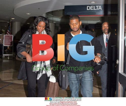 Usher and Tameka Foster Arrive at LAX