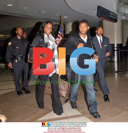 Usher and Tameka Foster Arrive at LAX