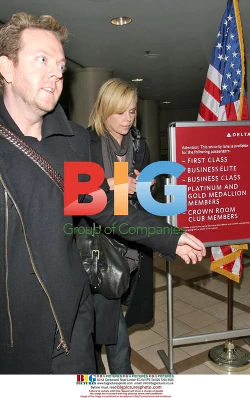 Charlize Theron arrives at LAX with friend