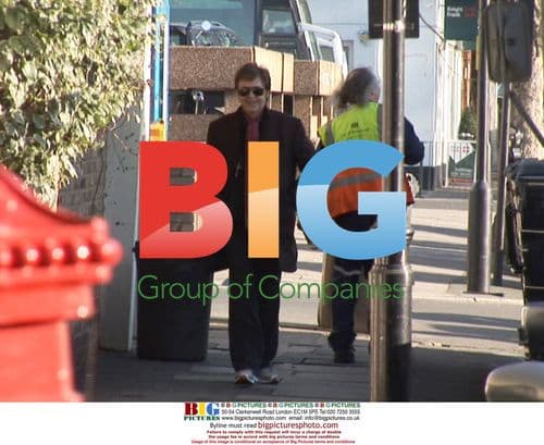 Paul McCartney Grabs Paparazzi Camera