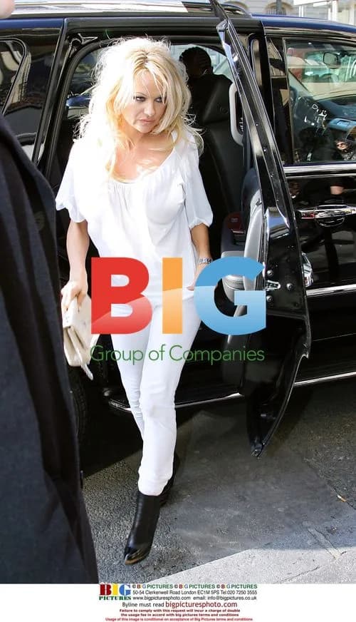 Pamela Anderson Leaves Paris Hotel