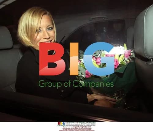 Denise Van Outen leaves London hotel with flowers