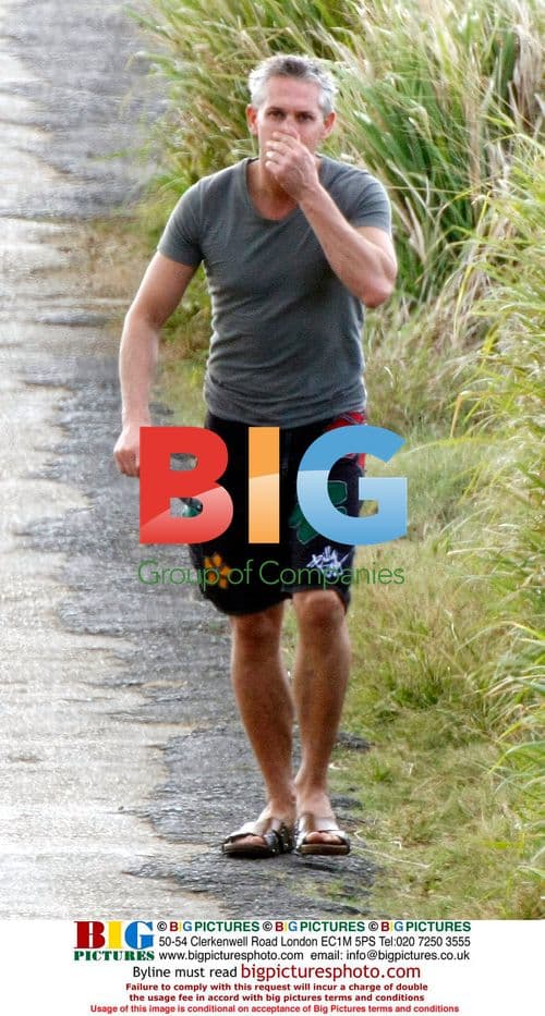 Gary Lineker takes a walk, leaving girlfriend behind