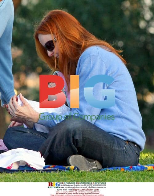 Marcia Cross takes her twins to the park