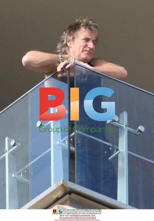 Rod Stewart Enjoys Morning Sunshine on Balcony