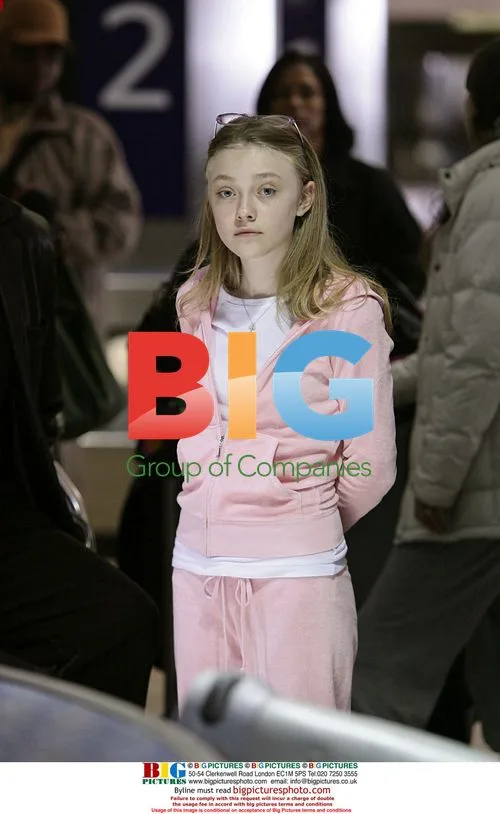 Dakota Fanning Arrives at LAX Ahead of 14th Birthday