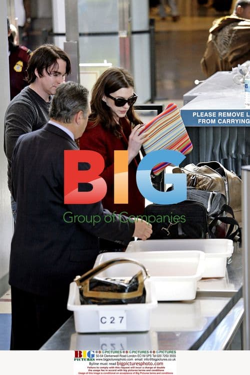 Anne Hathaway smiles with boyfriend and dog