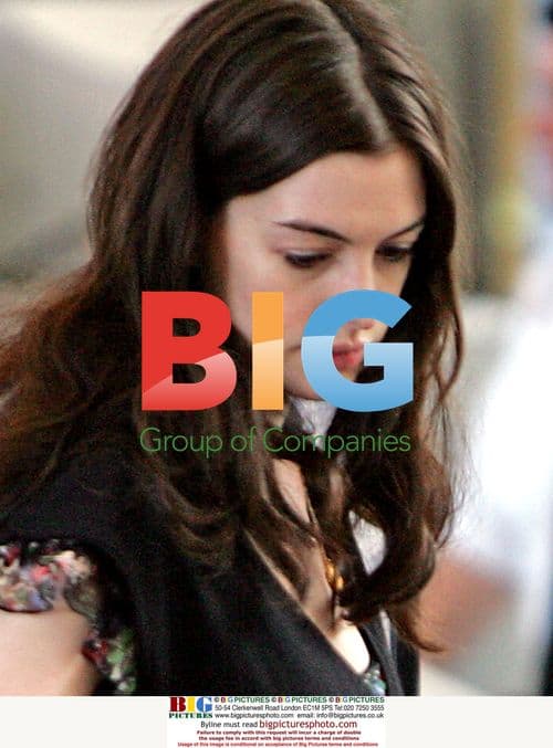 Anne Hathaway departs LAX with pup and boyfriend