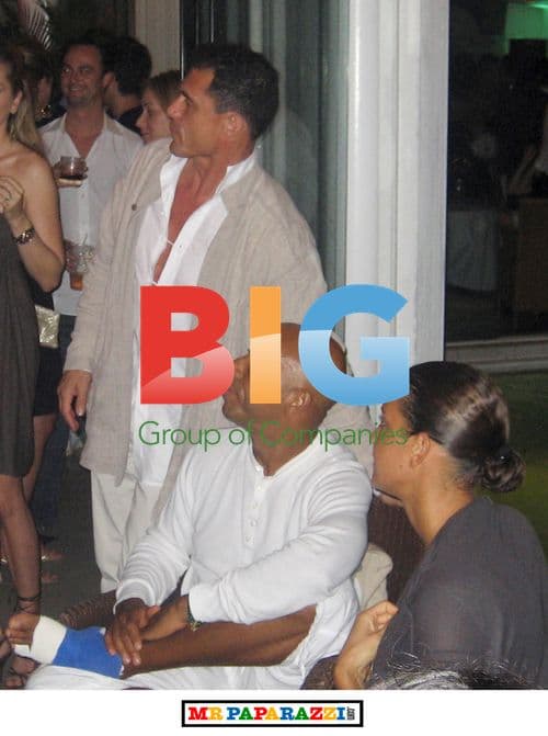 Russell Simmons with girlfriend at party