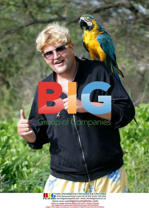 Jason Davis Poses with Parrot in Maui